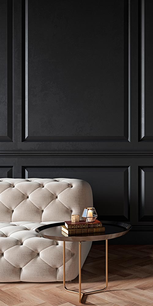 Bold dark panelled wall with white sofa